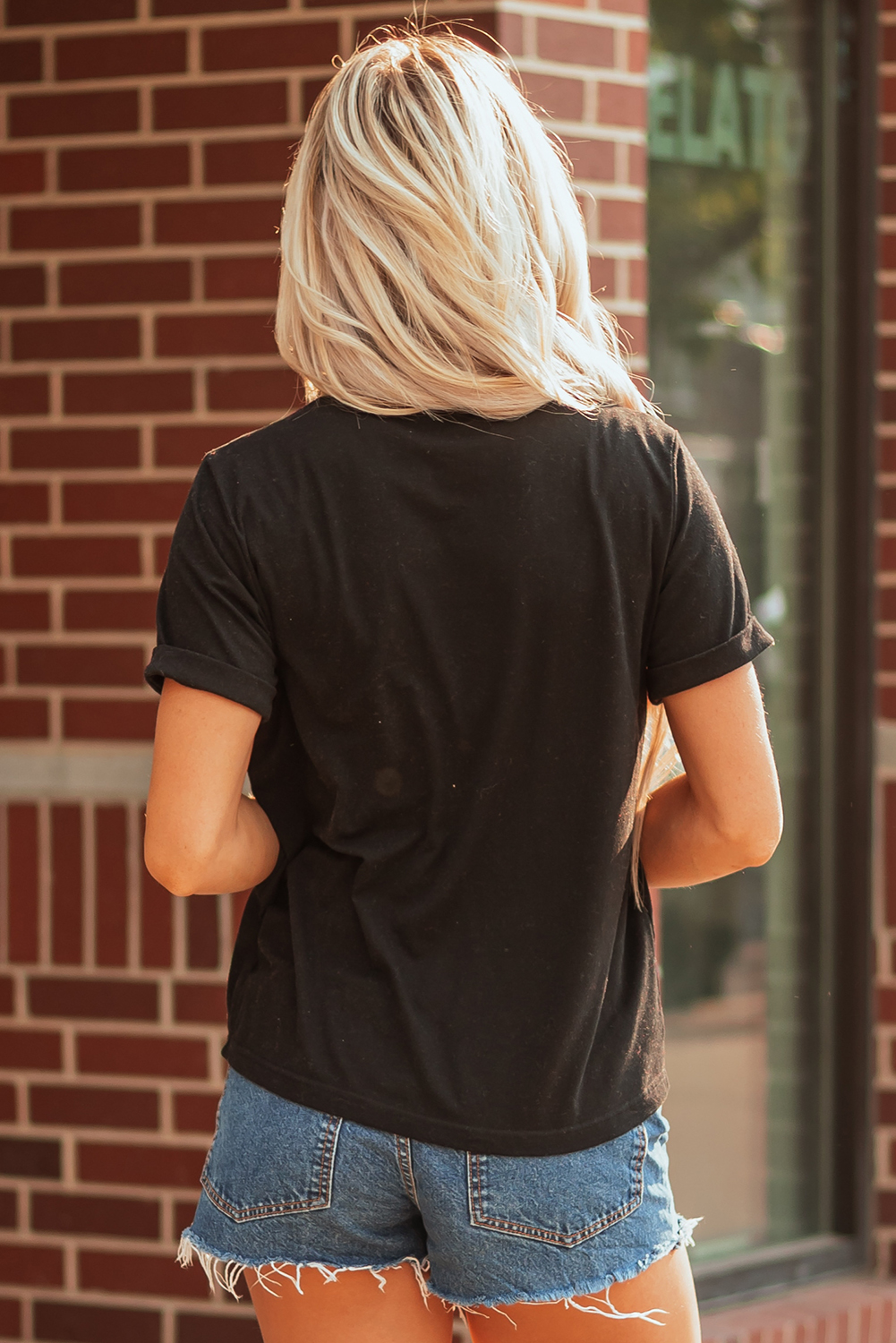 Black Shimmering Sequin Bow Ball Patterned Game Day Casual Tee - Image 2
